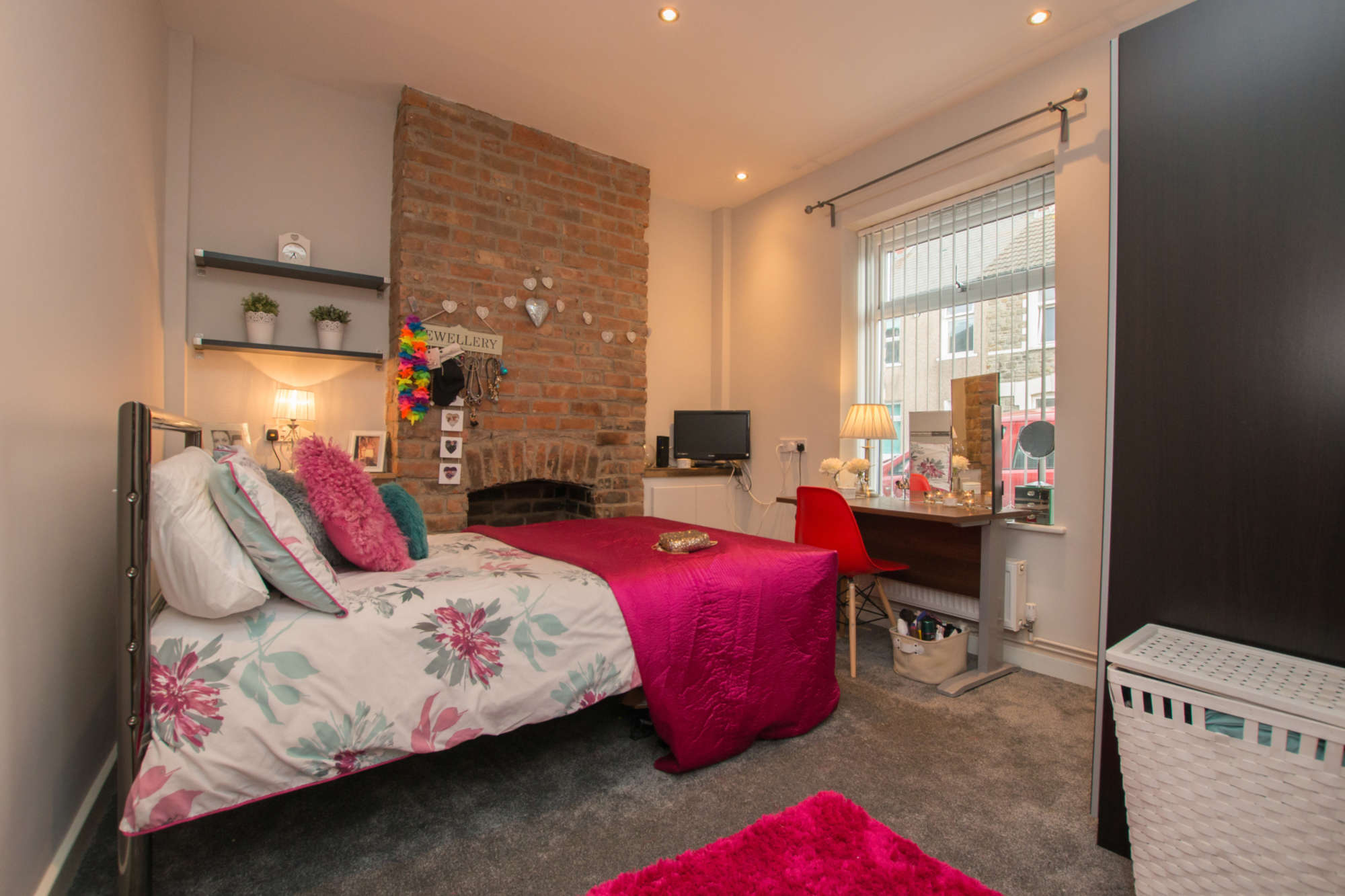 Bedroom with exposed brickwork