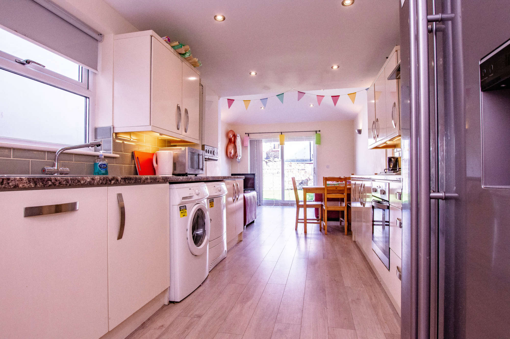 Open plan kitchen/living area with American fridge/freezer