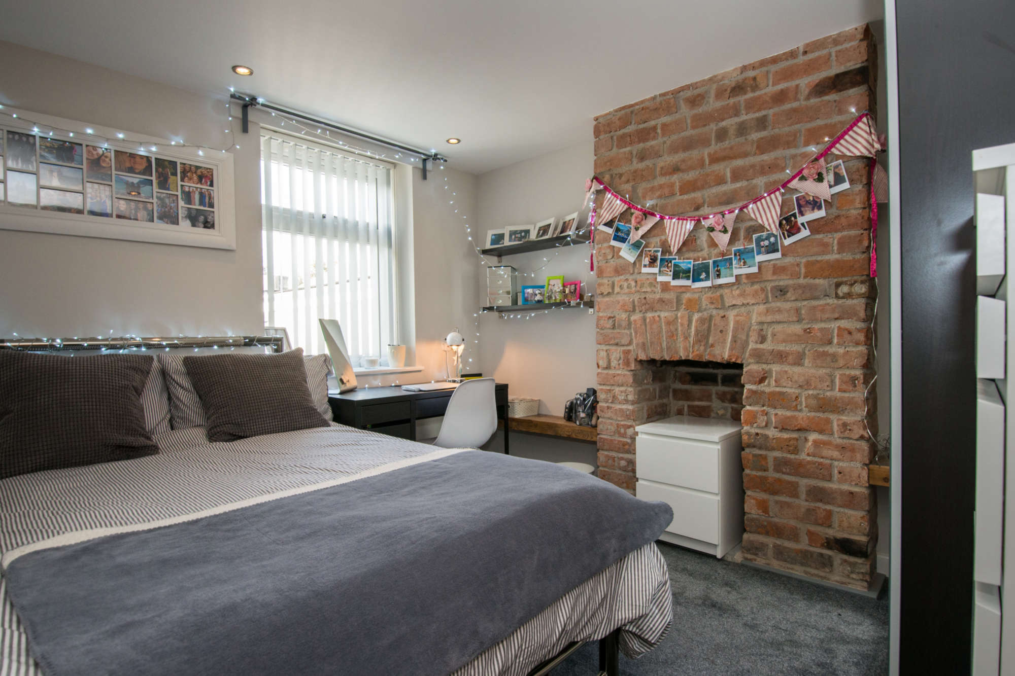 Bedroom with exposed brickwork