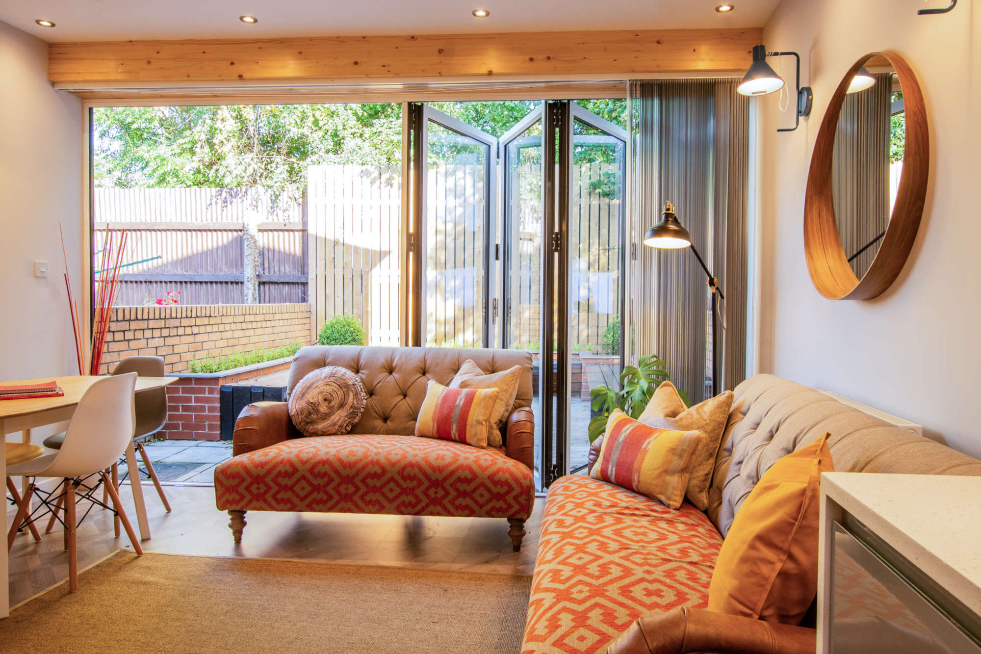 Stunning lounge/diner with bifold doors onto courtyard