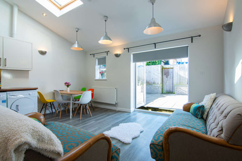 Living room with glass doors onto courtyard