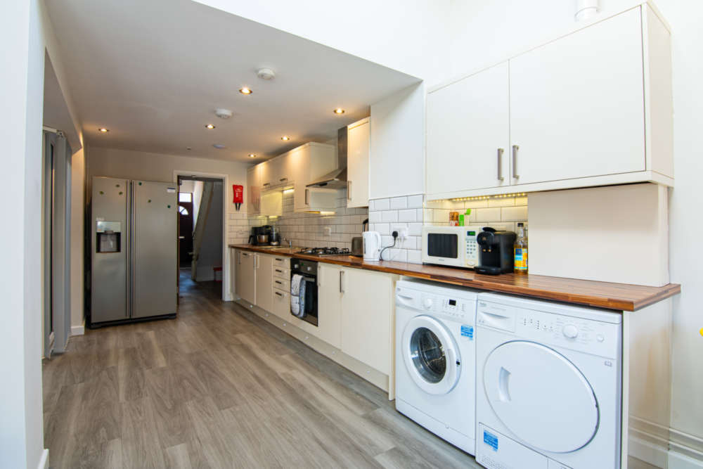 Open-plan kitchen with American fridge/freezer